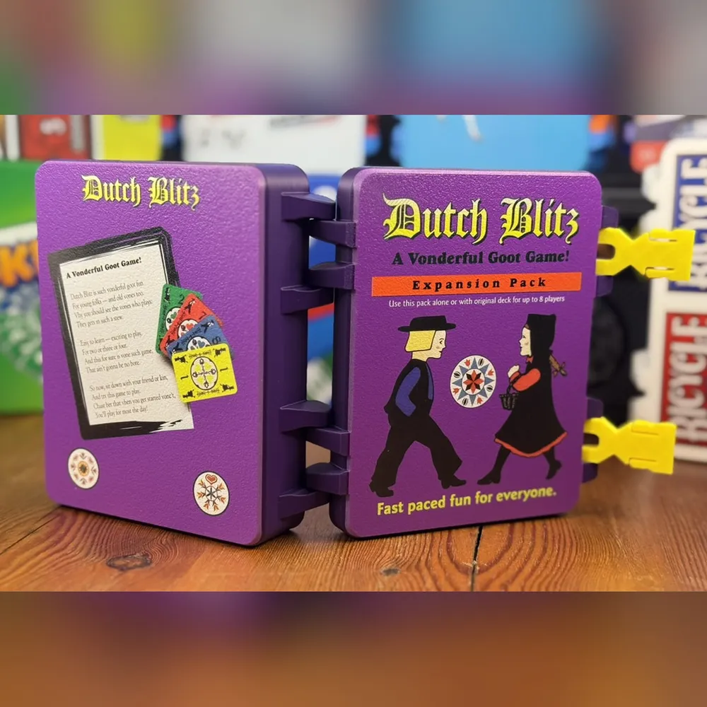 a purple case with printed artwork on the lid and the rules inside