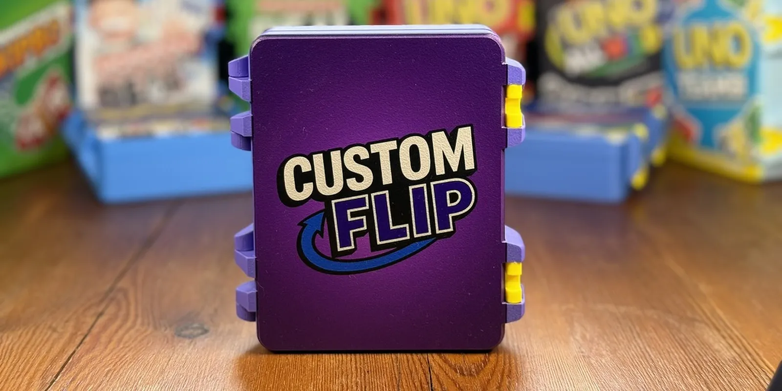 a purple case with a custom printed lid, in front of a shelf of games