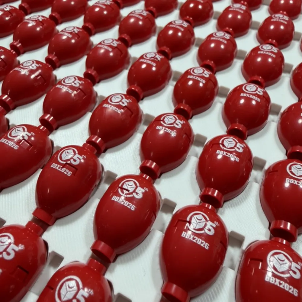 rows of red pieces printed with an event logo