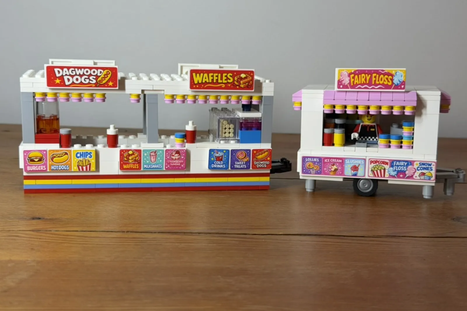 LEGO food stalls with printed signs and menus